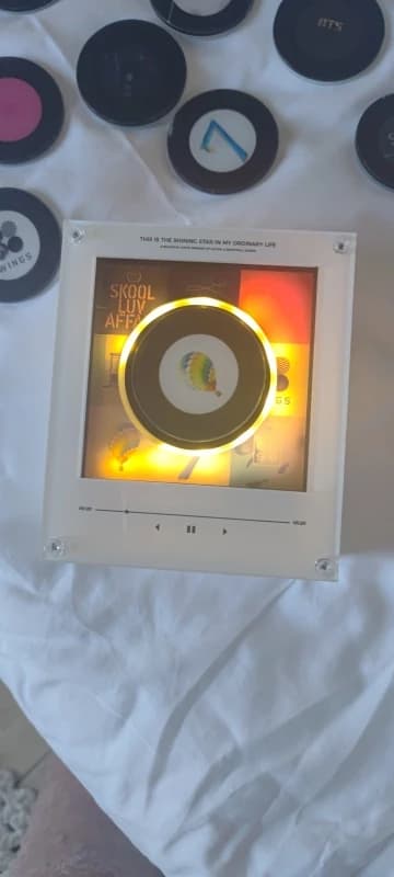 Photo from this review of Christmas Mini NFC Music Box Refrigerator Magnet Cute Record Player Style Ambient Night Light for Teen Gifts